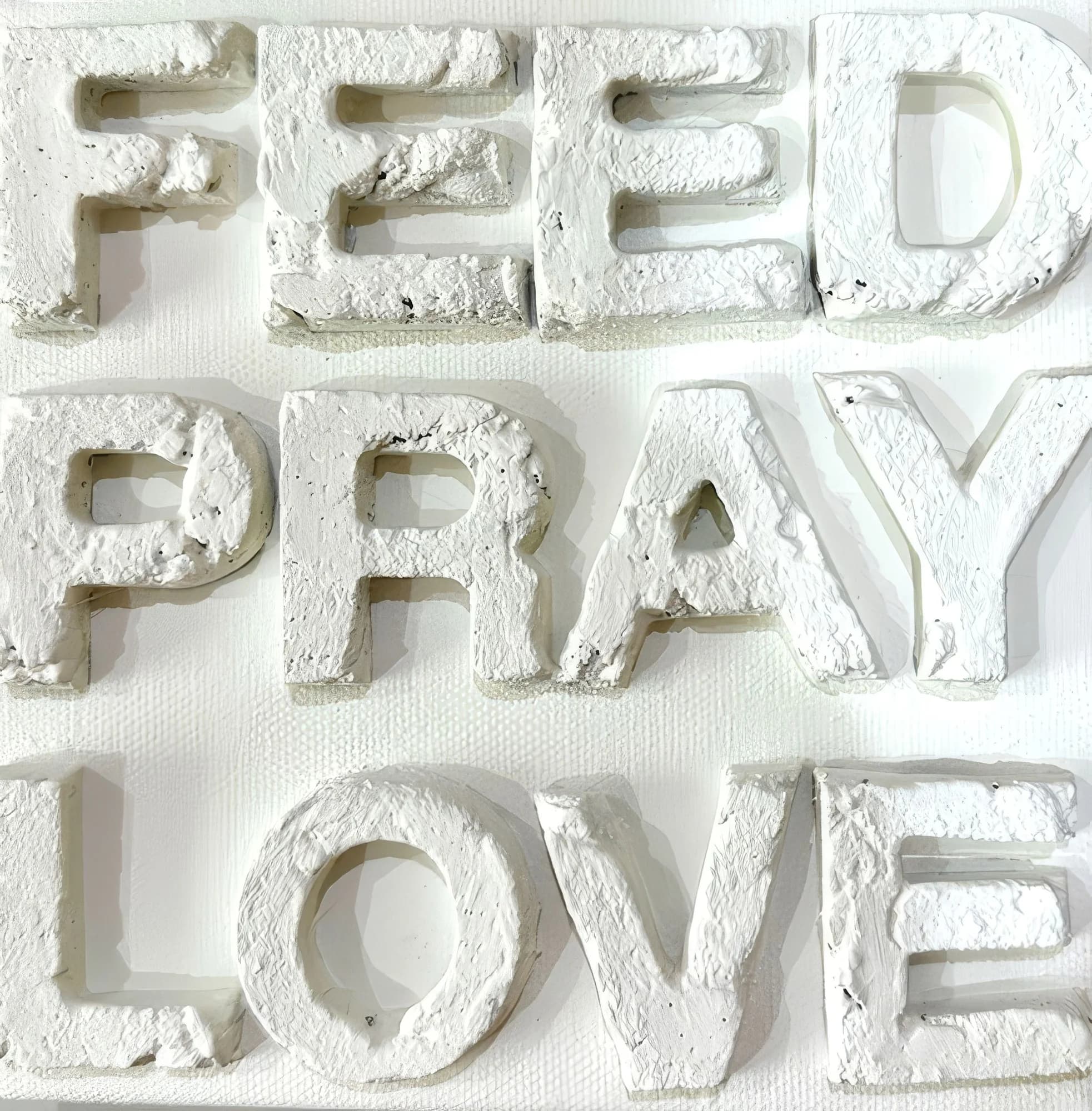 FEED PRAY LOVE Sign White on White